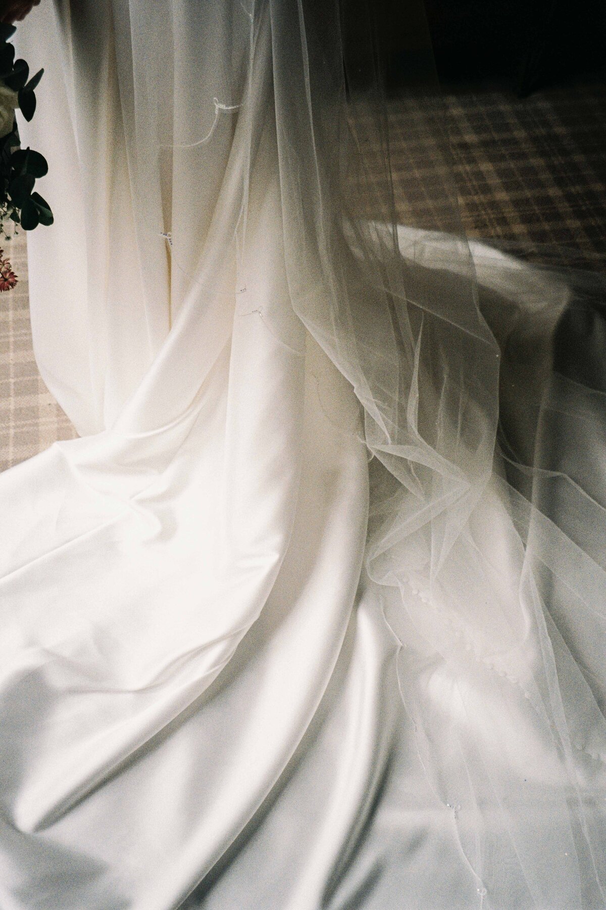 A close up photograph of a wedding dress.