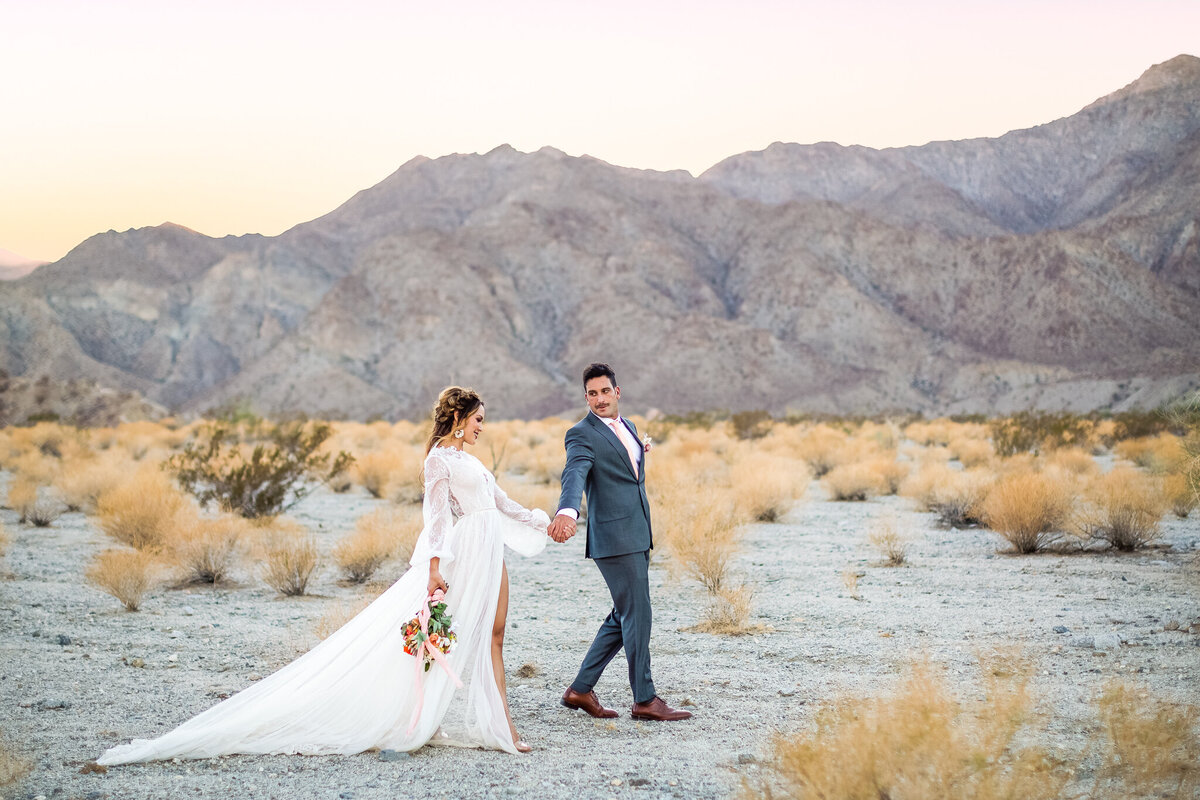 couples wedding portraits at sunset with mountain views in Palm Springs, CA