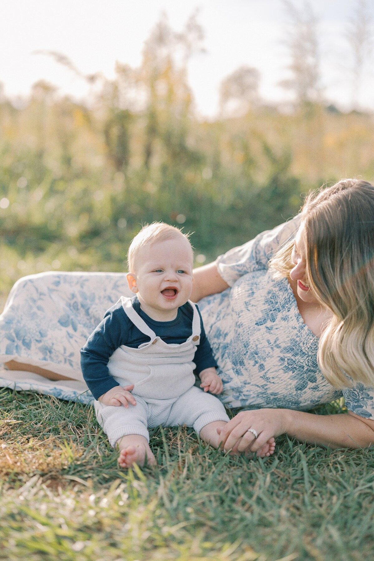 baby-sitting-in-grass-with-mom