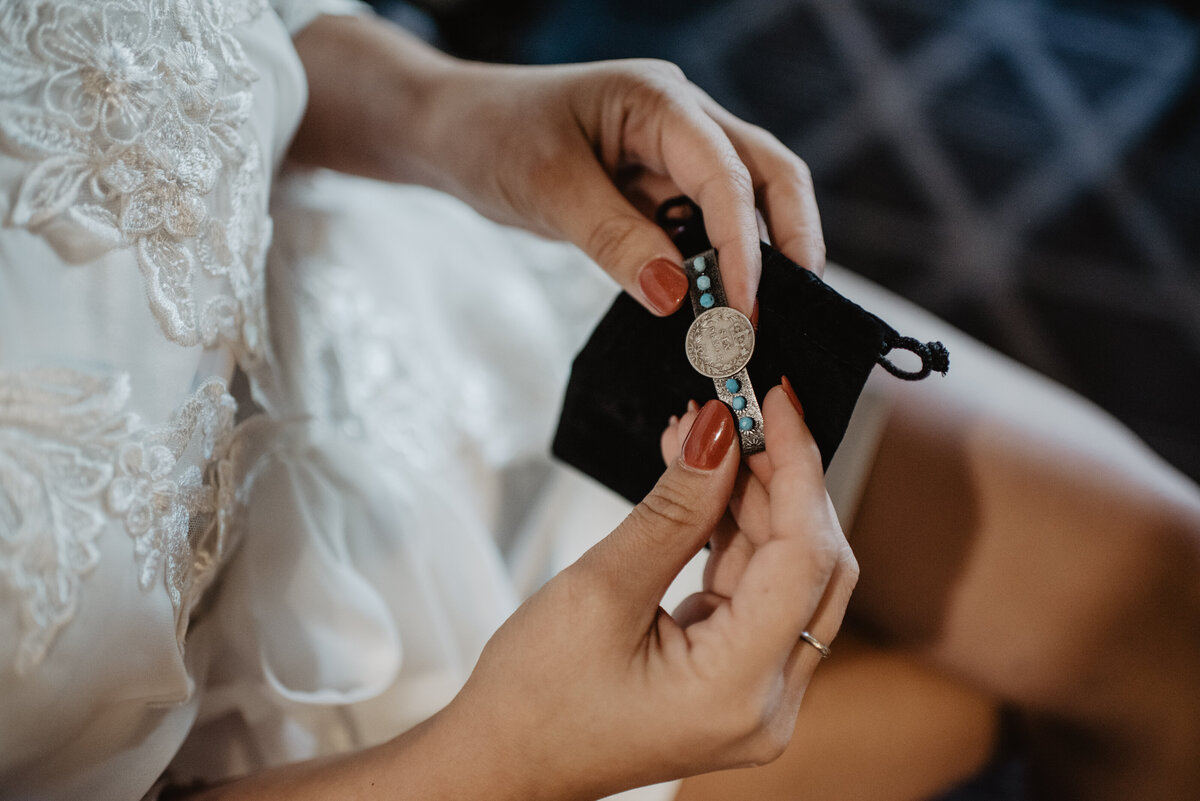 Photographers Jackson Hole capture bride holding jewelry