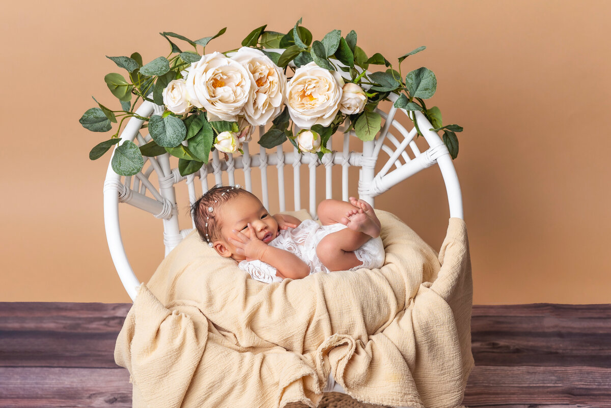 DMV - Photobyshai - Newborn laying in white chair with roses