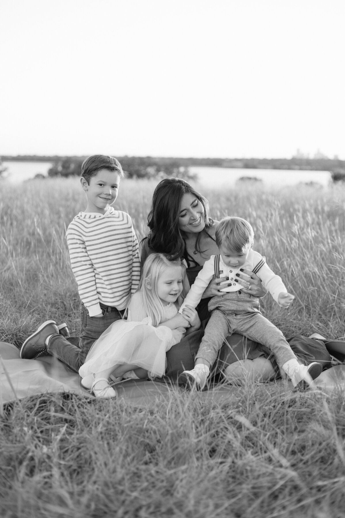 Family session at White Rock Lake in Dallas, TX. Photo taken with mother and her three children.