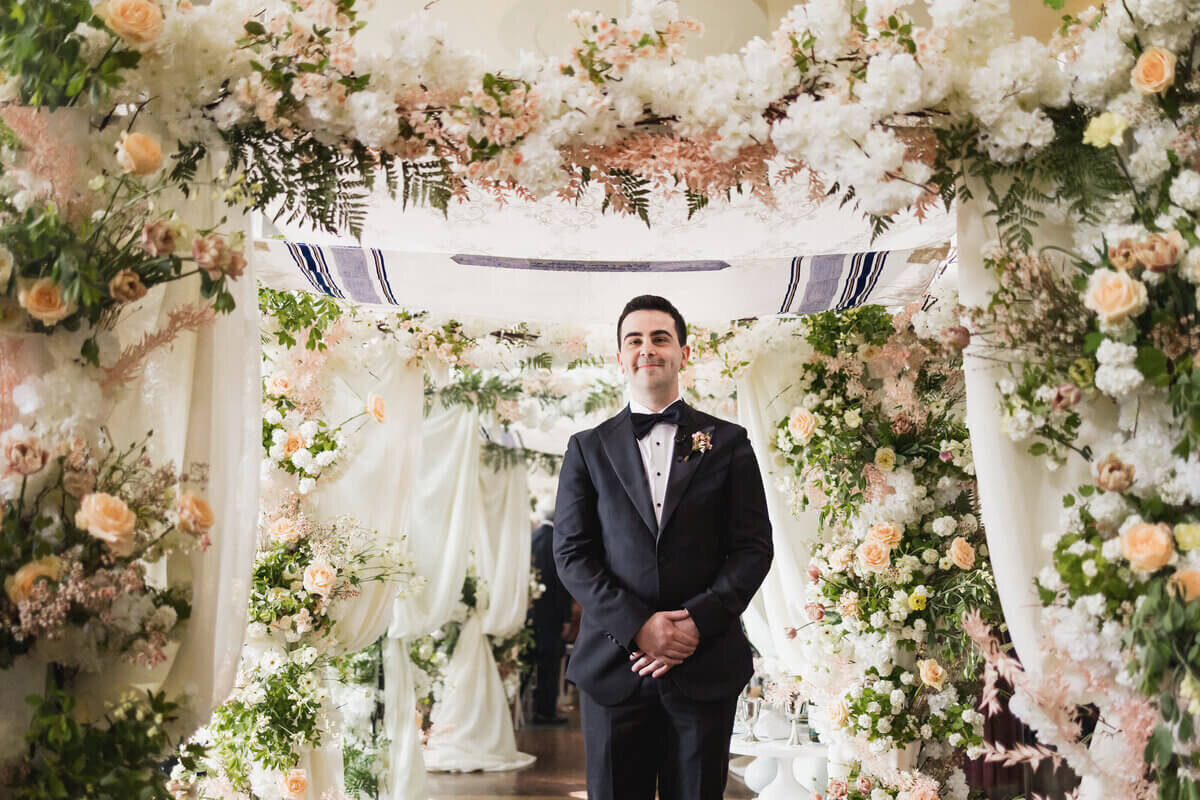 Groom waiting for bride at end of aisle to show planning a wedding in chicago