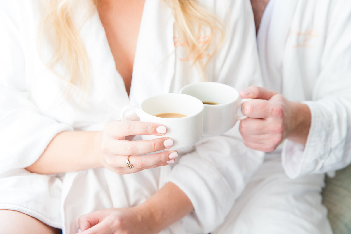 Bride and groom sharing a cozy coffee in robes before their Veuve-inspired wedding at Palmetto Bluff in Charleston SC | Charleston wedding photographer Dana Cubbage Weddings