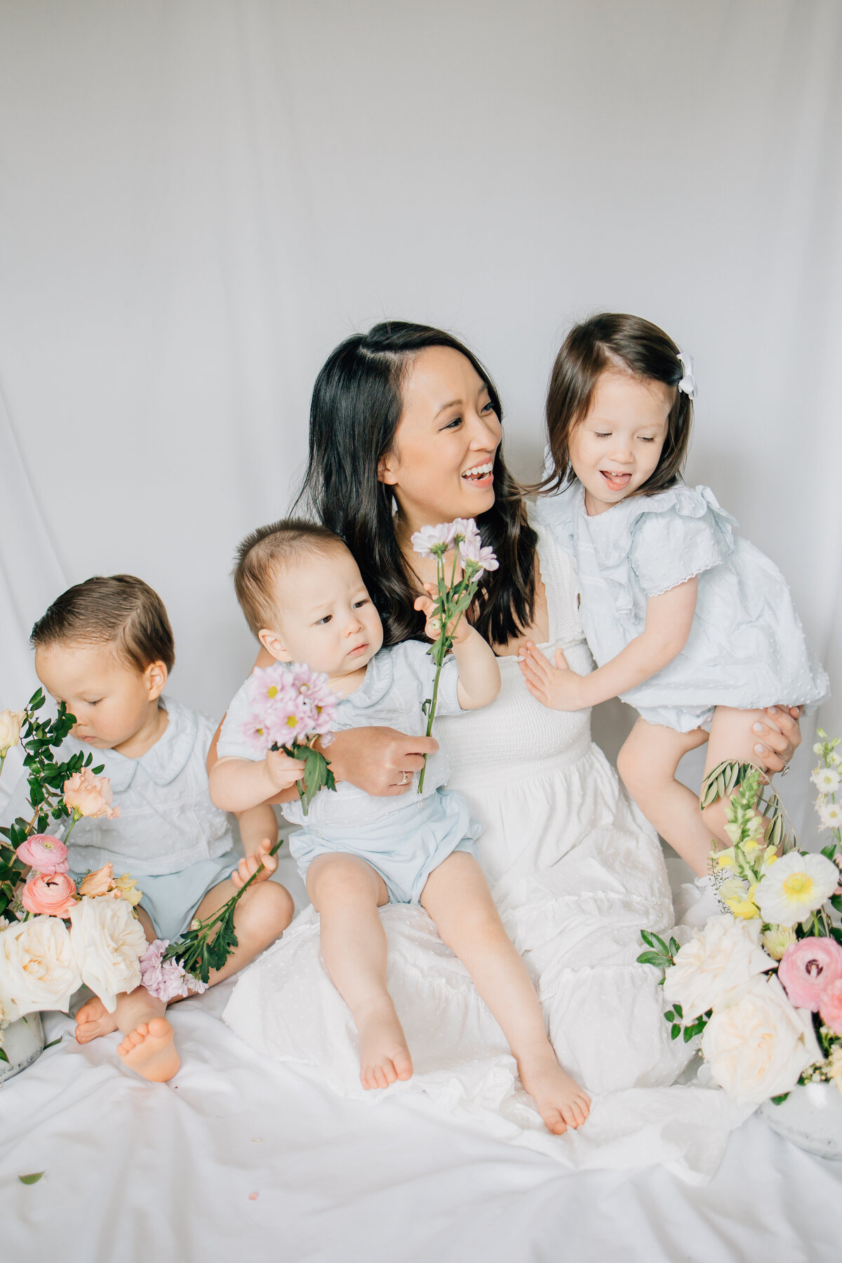 In-studio motherhood session with florals located in Lewisville,TX