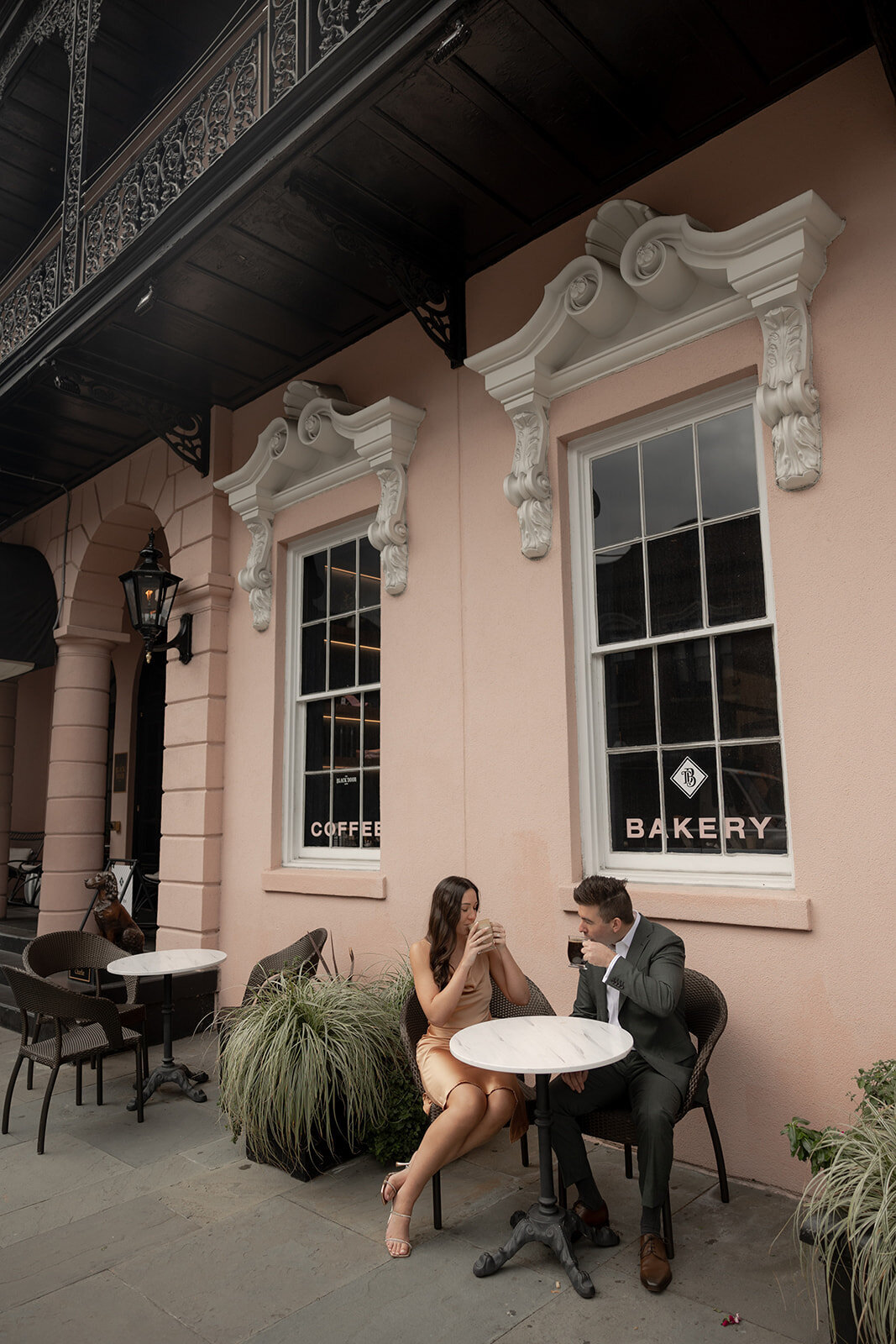 Couple sitting at table drinking coffe at Mills House Charleston