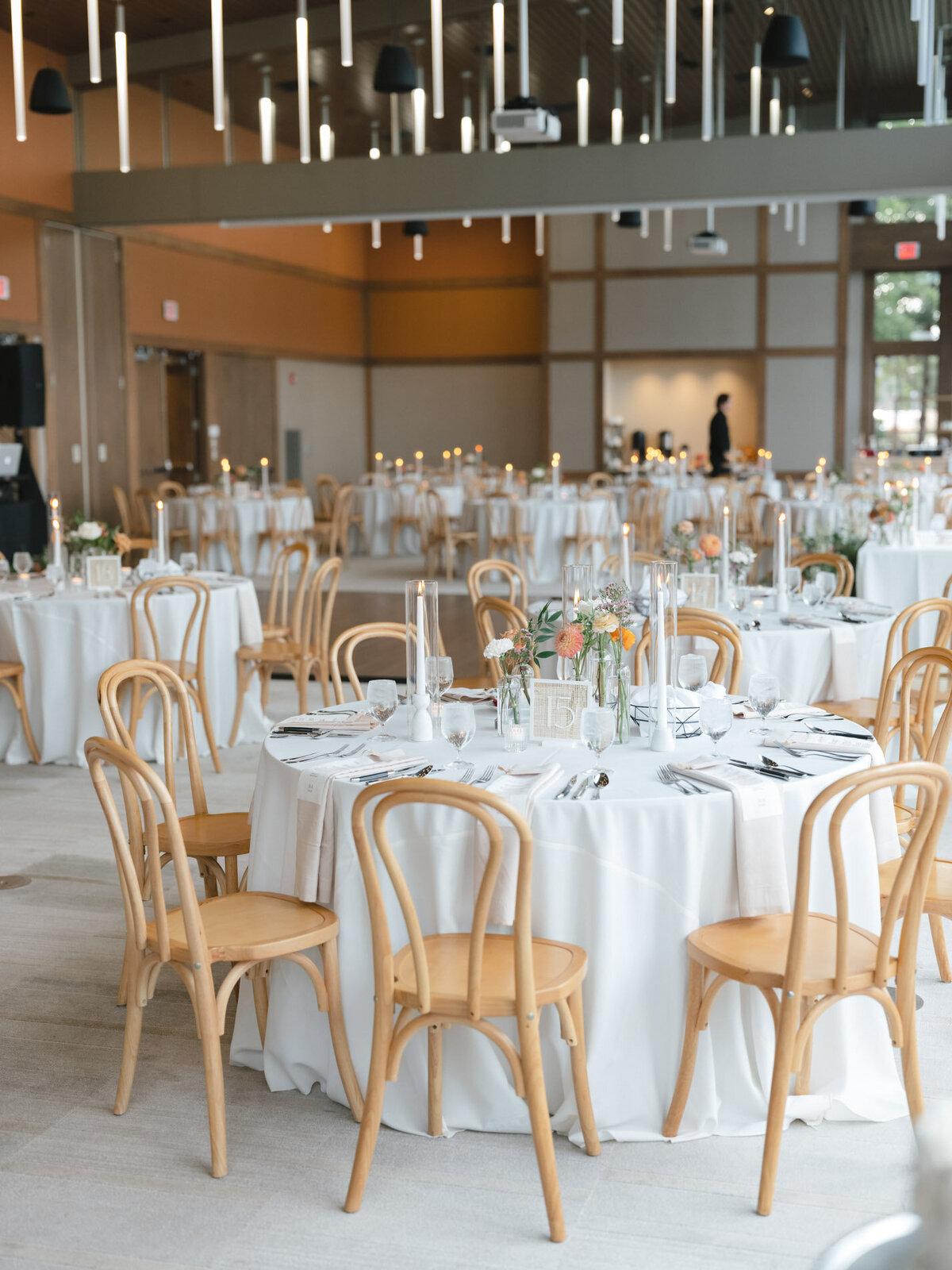 oregon wedding reception tables with wood chairs featuring custom calligraphy details by life in letters representing full service design and calligraphy by Life in Letters.