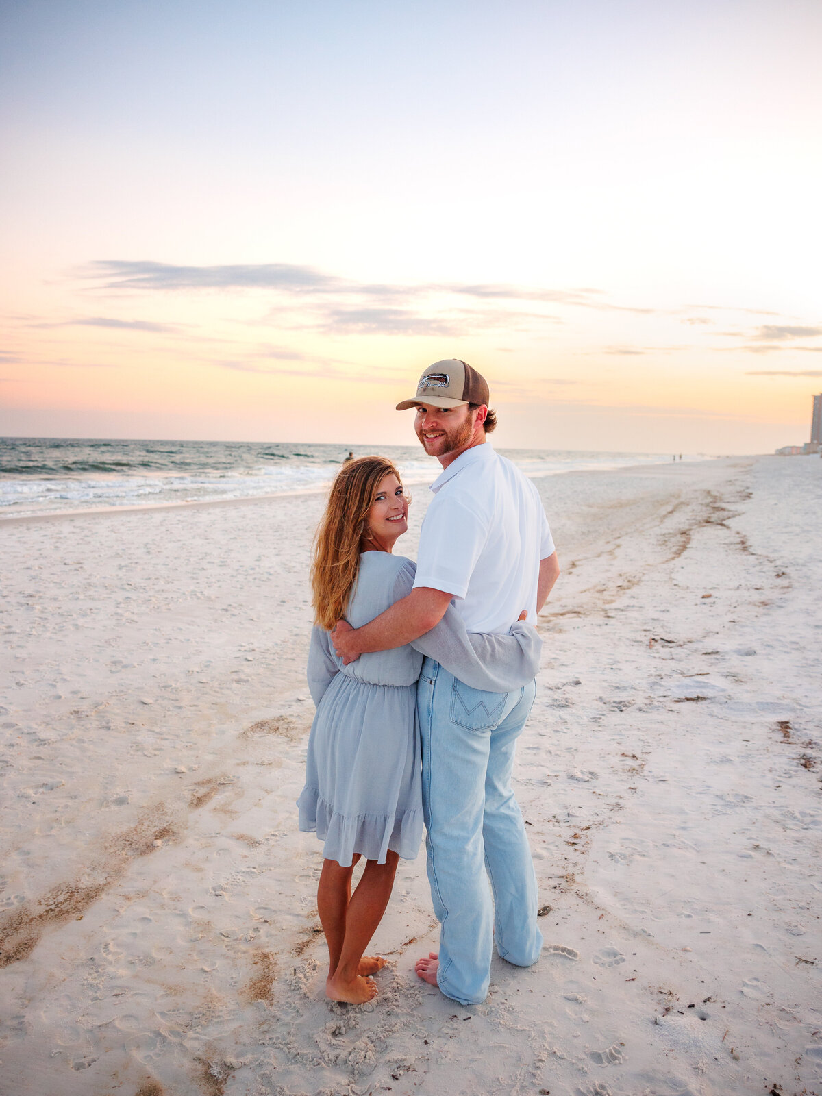 Golden horizon as couple looks over the shoulder 