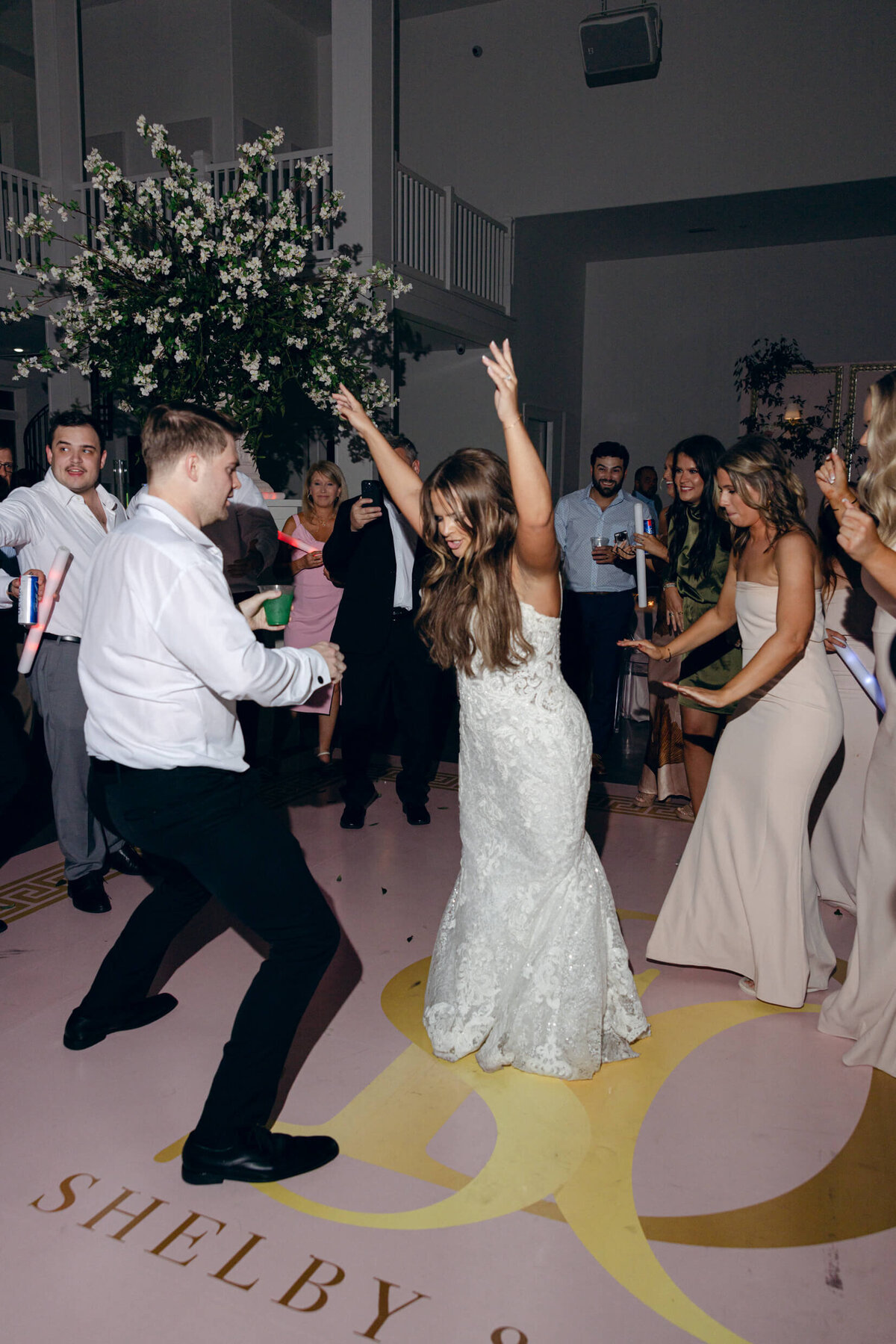 A wedding photo of the bride and groom dancing during the wedding reception