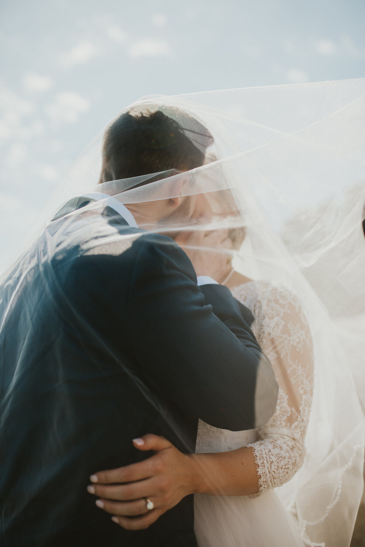 wedding photos with couple under veil