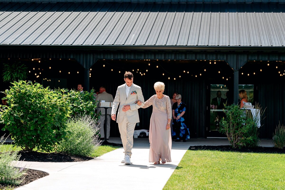 groom-and-grandmother-walking-aisle