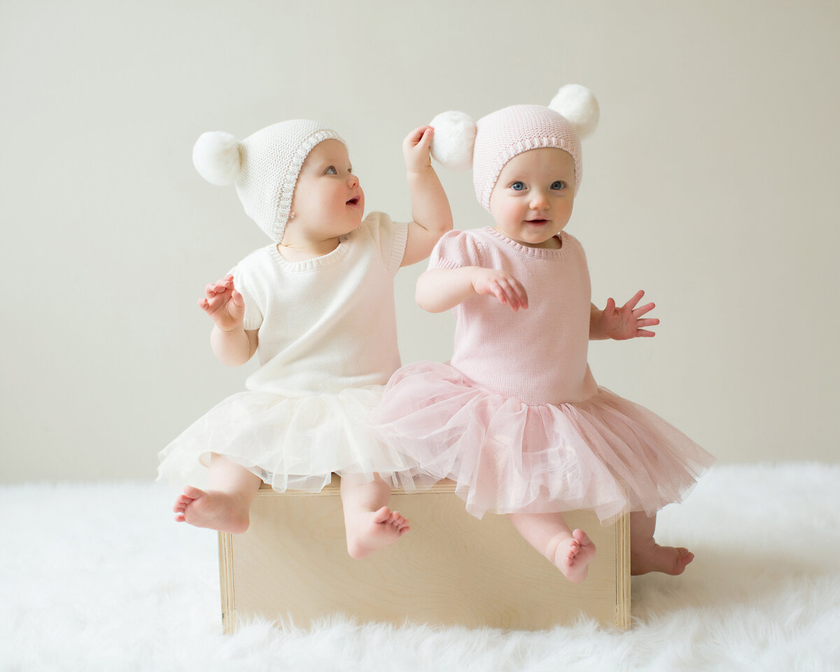 one_year_old_twins_with_winter_hats
