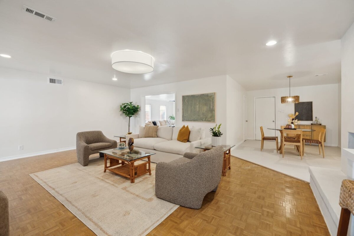 3120 Chapel Downs Dr Dallas TX living room featuring open layout with dining nook, neutral palette, and stylish modern lighting — listed by Haven Realty Group.