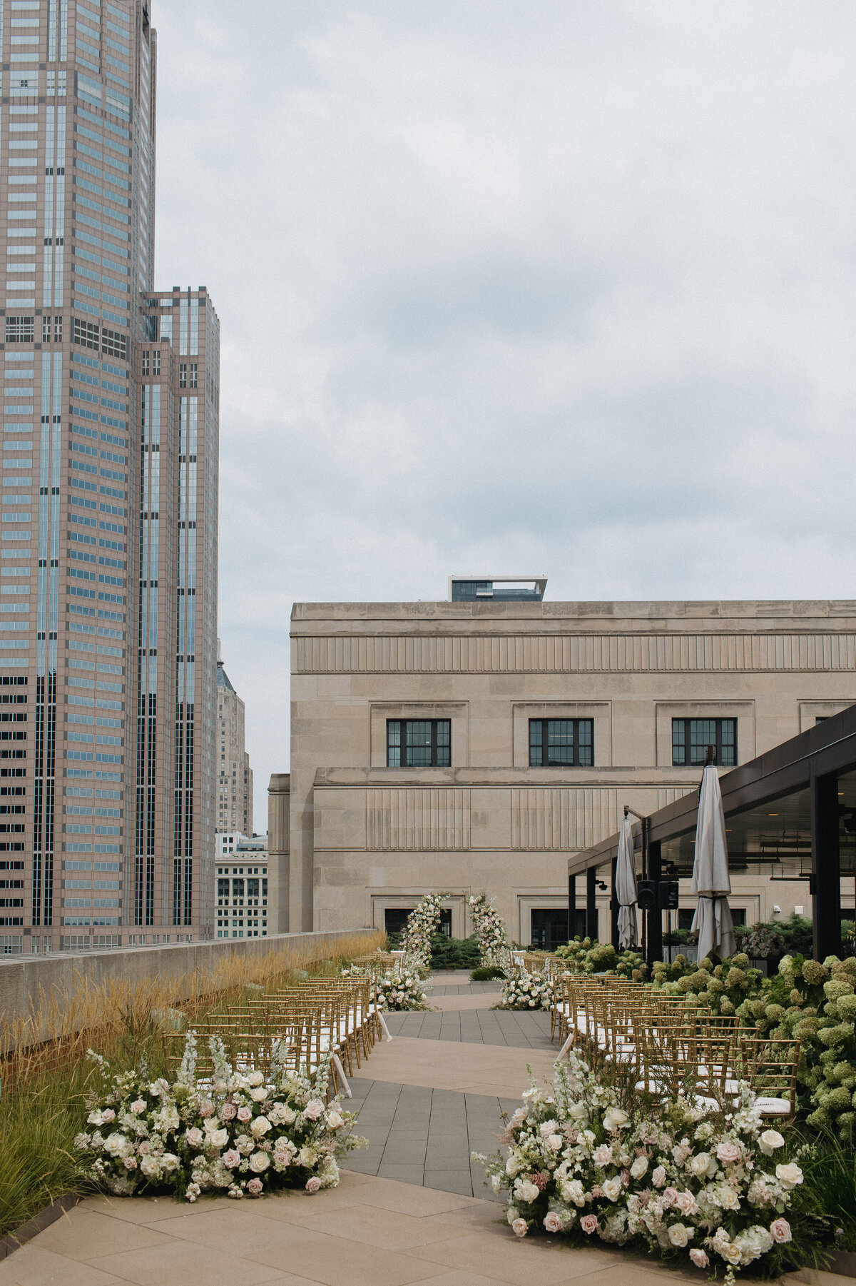 Film photography captures editorial ceremony elegance at Old Post Office Chicago with Lauren Alatriste's fashion forward approach, showcasing architectural grandeur while maintaining sophisticated luxury wedding imagery and authentic emotional storytelling.