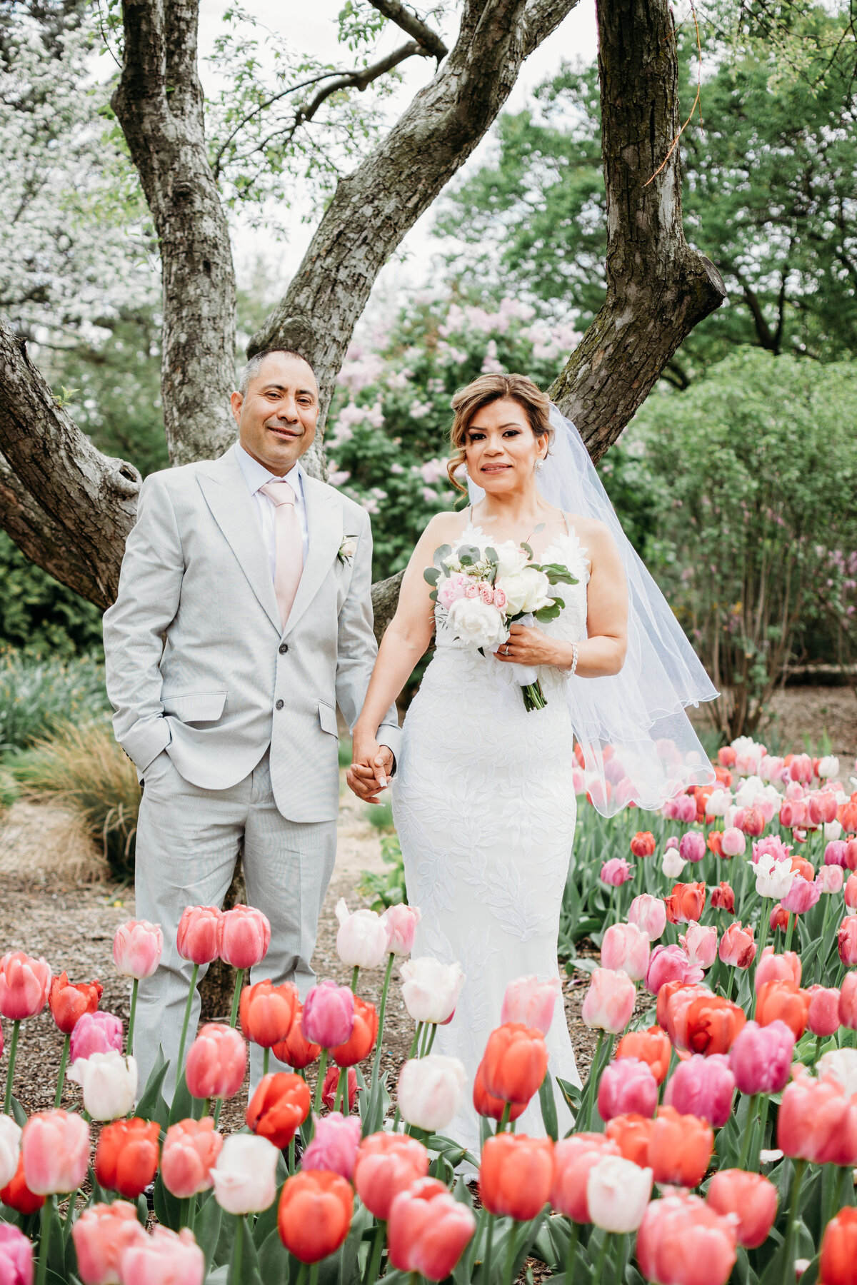 a couple who is 25 years married pose for romantic photos as they celebrate their vow renewal, Lombard, IL