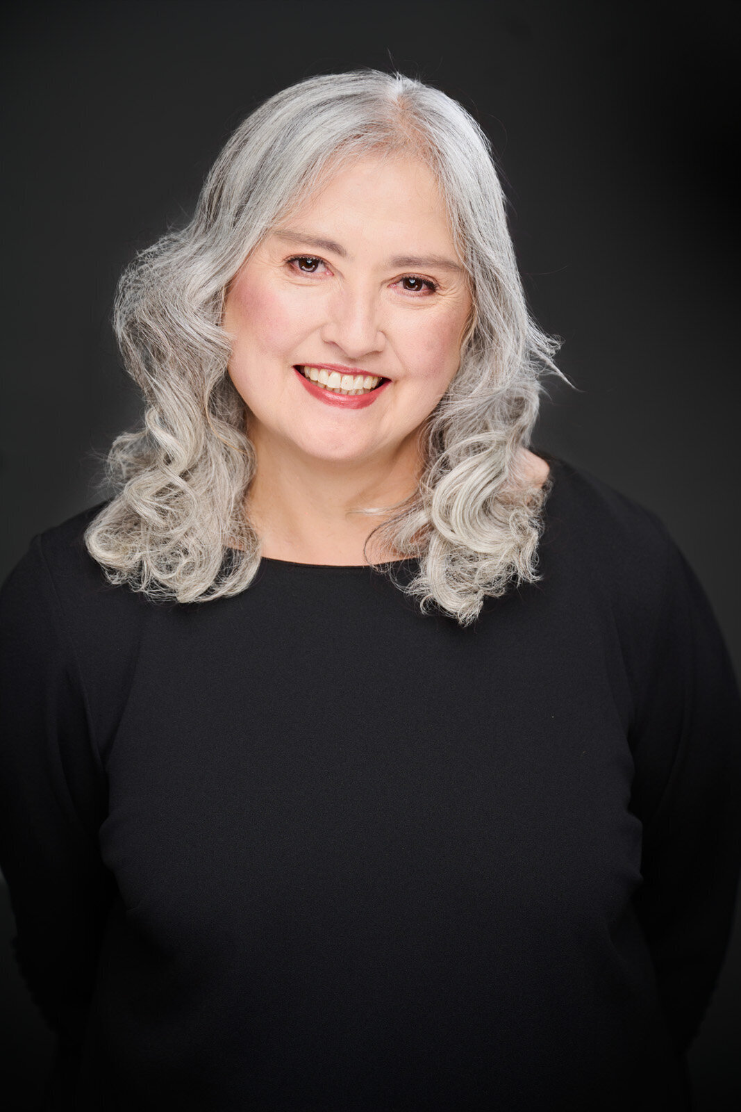 Elegant Portrait of a Smiling Woman Over 40 with Gray Hair-186