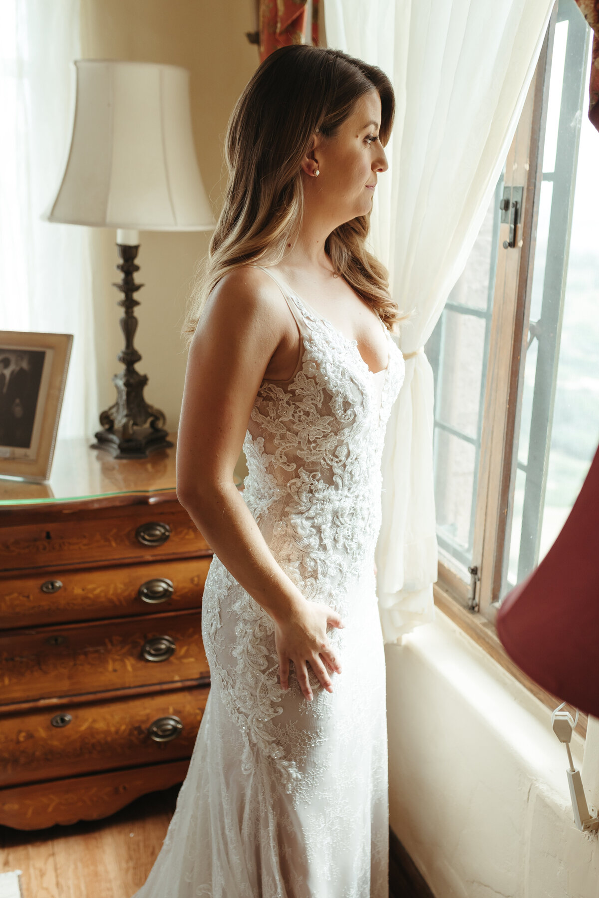 Bride in a lace  wedding dress on her wedding day.