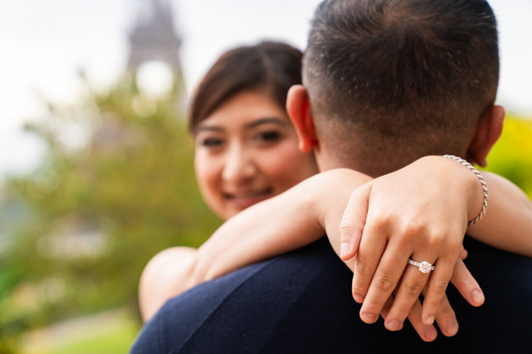 Paris engagement ring detail shot, close-up proposal moment, romantic photography session