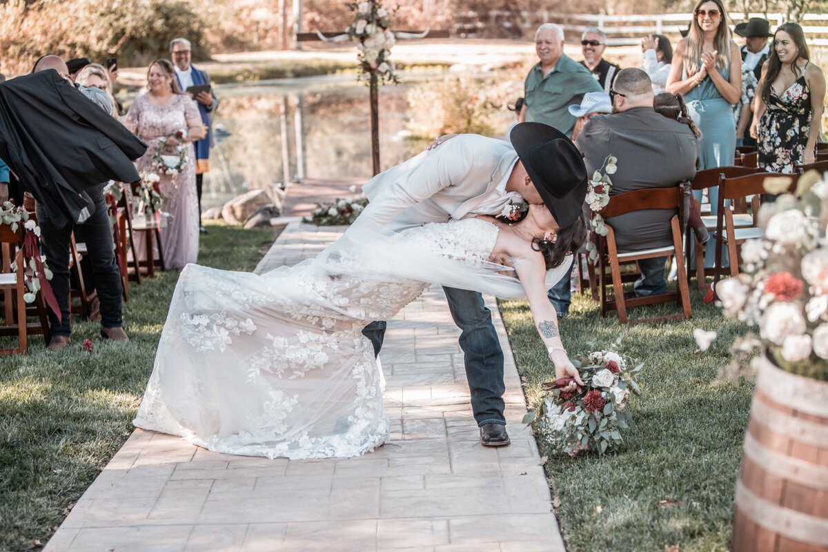 bride and groom dipping during ceremony