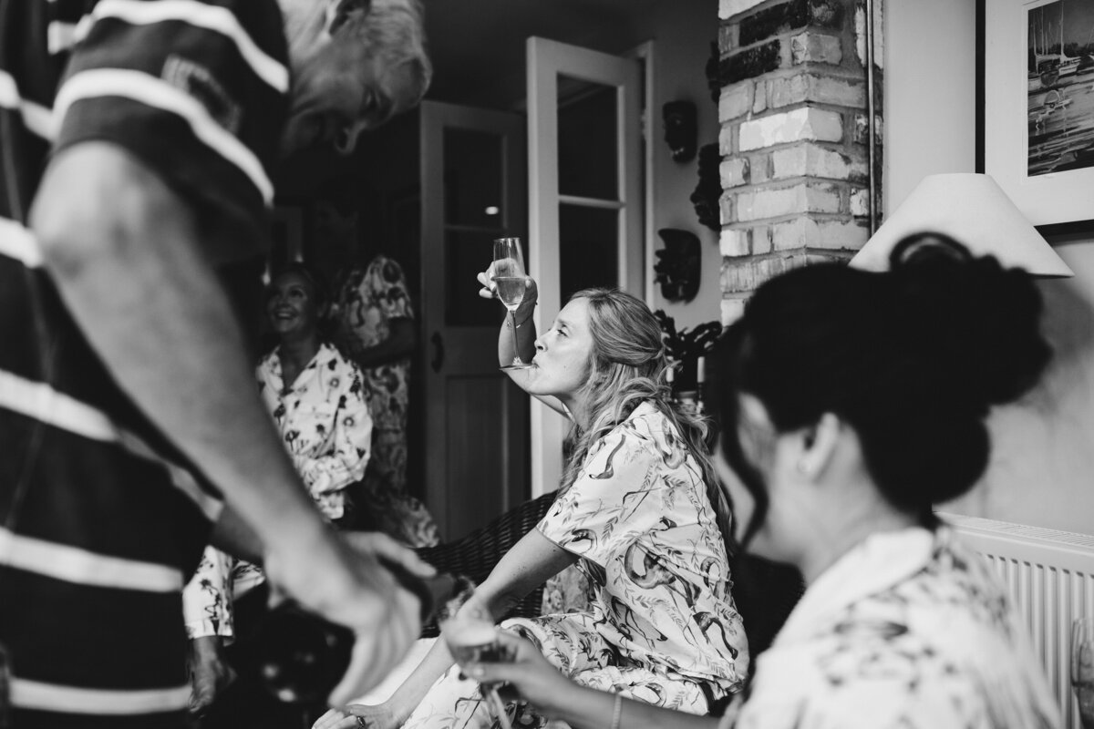 Black adn white photo of bride getting ready with her birthday party