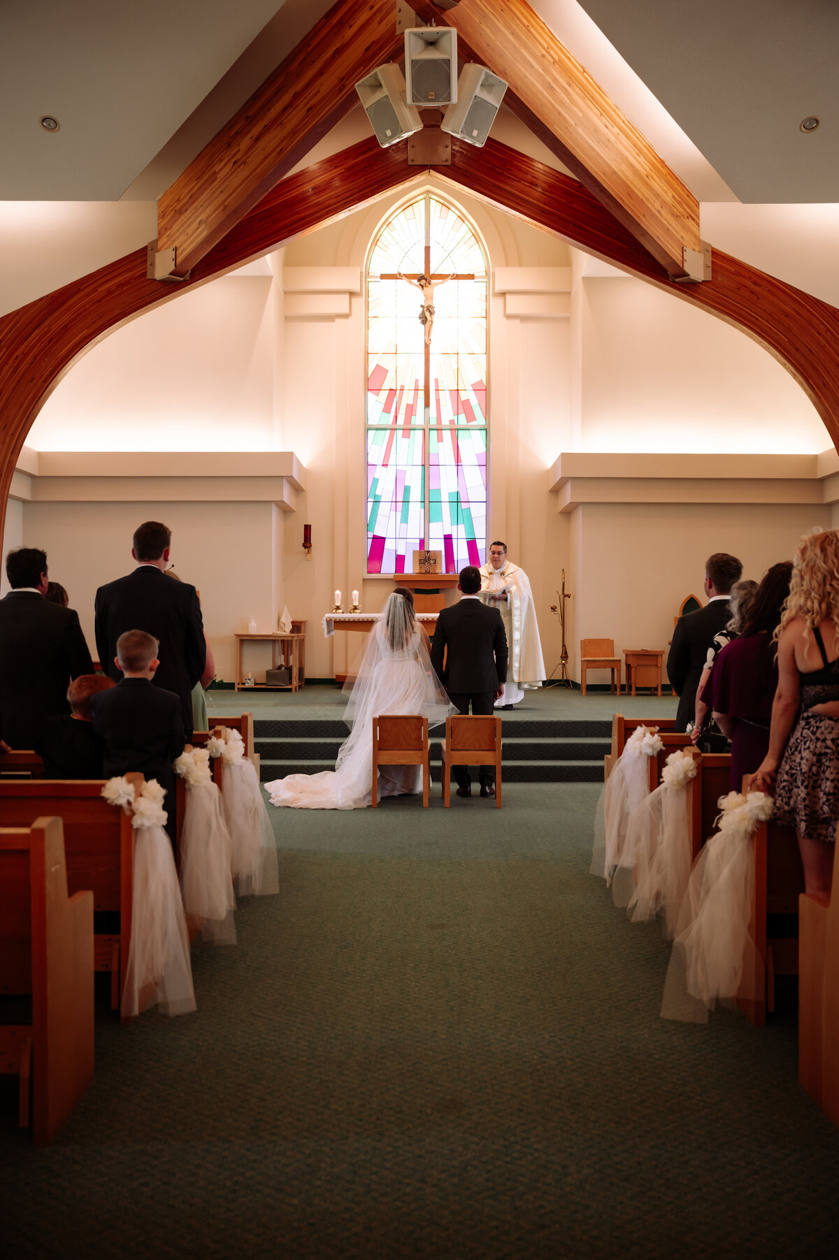 bride and groom at the alter sharing their vows on their wedding day