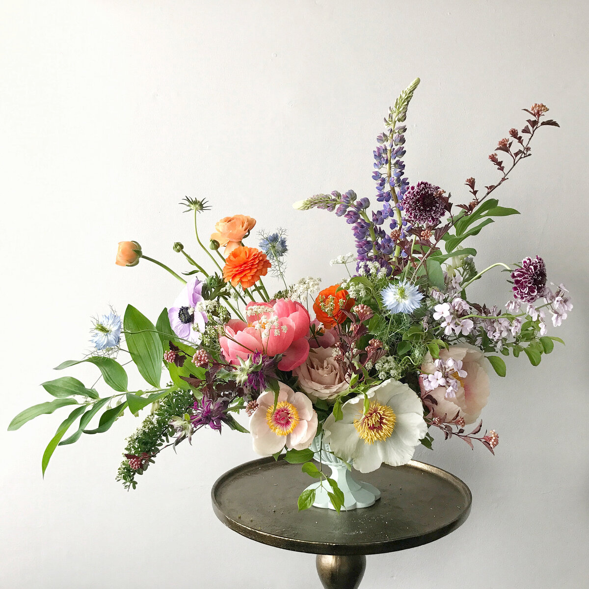 A lush floral garden arrangement at a Montreal wedding reception.