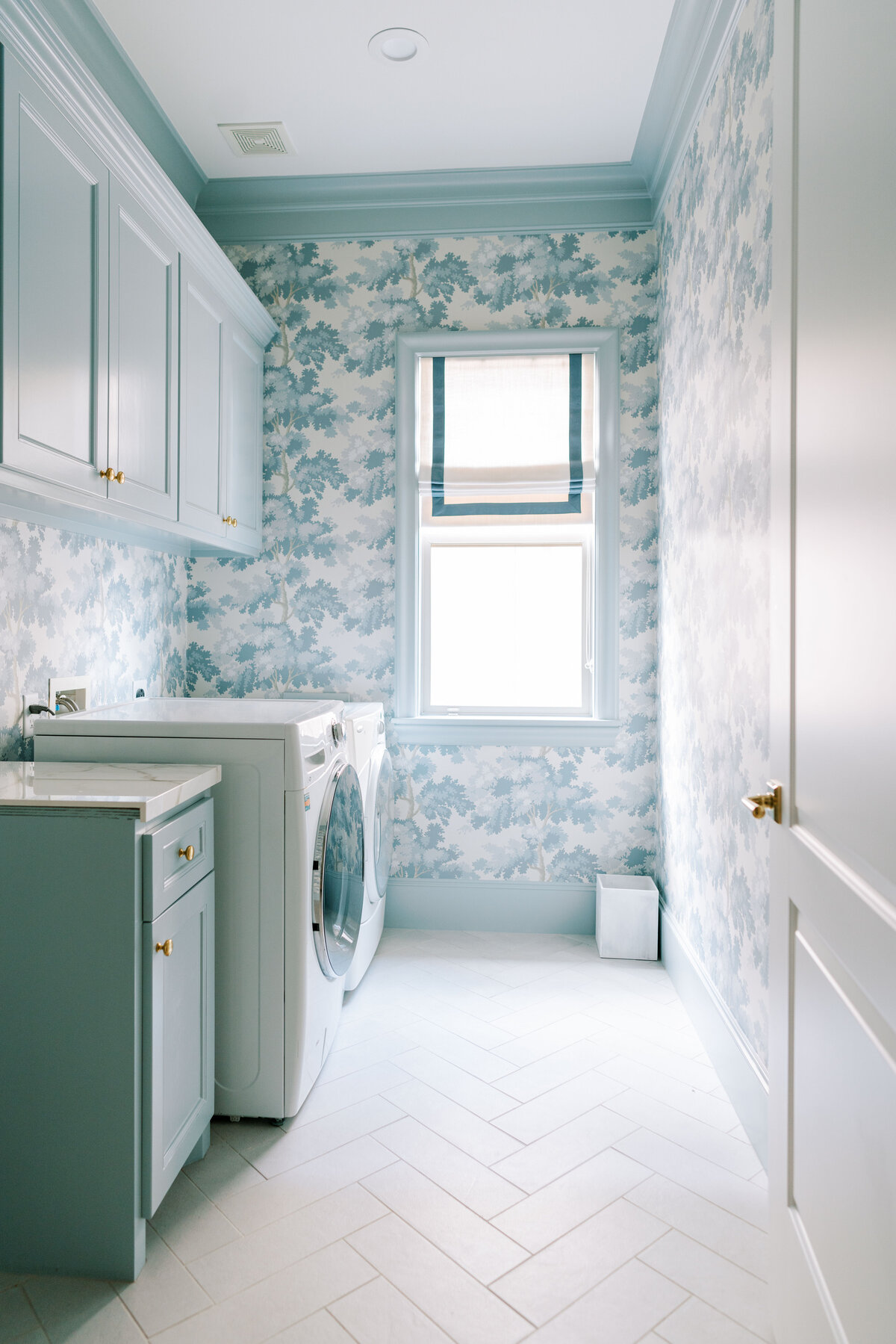 oyster creek studios spring valley remodel blue and white wallpaper laundry room