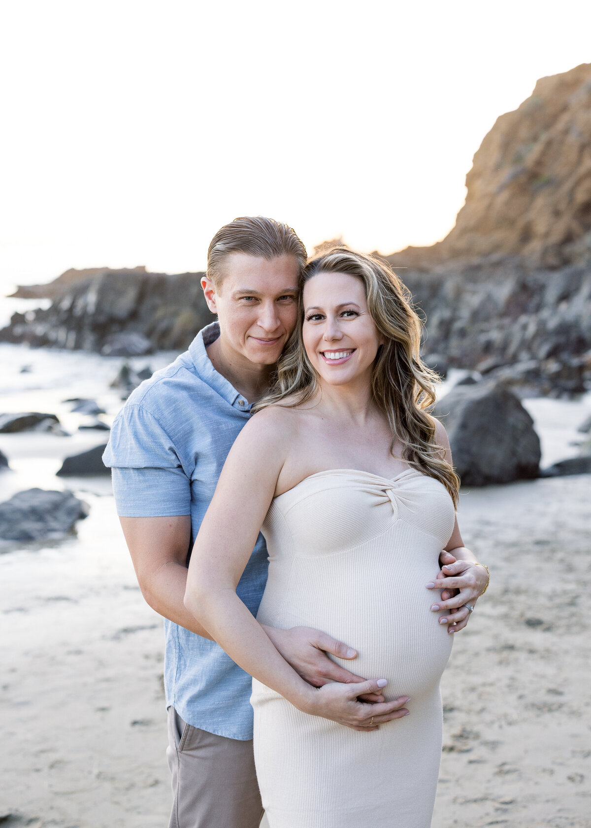 smiling maternity photo on the beach