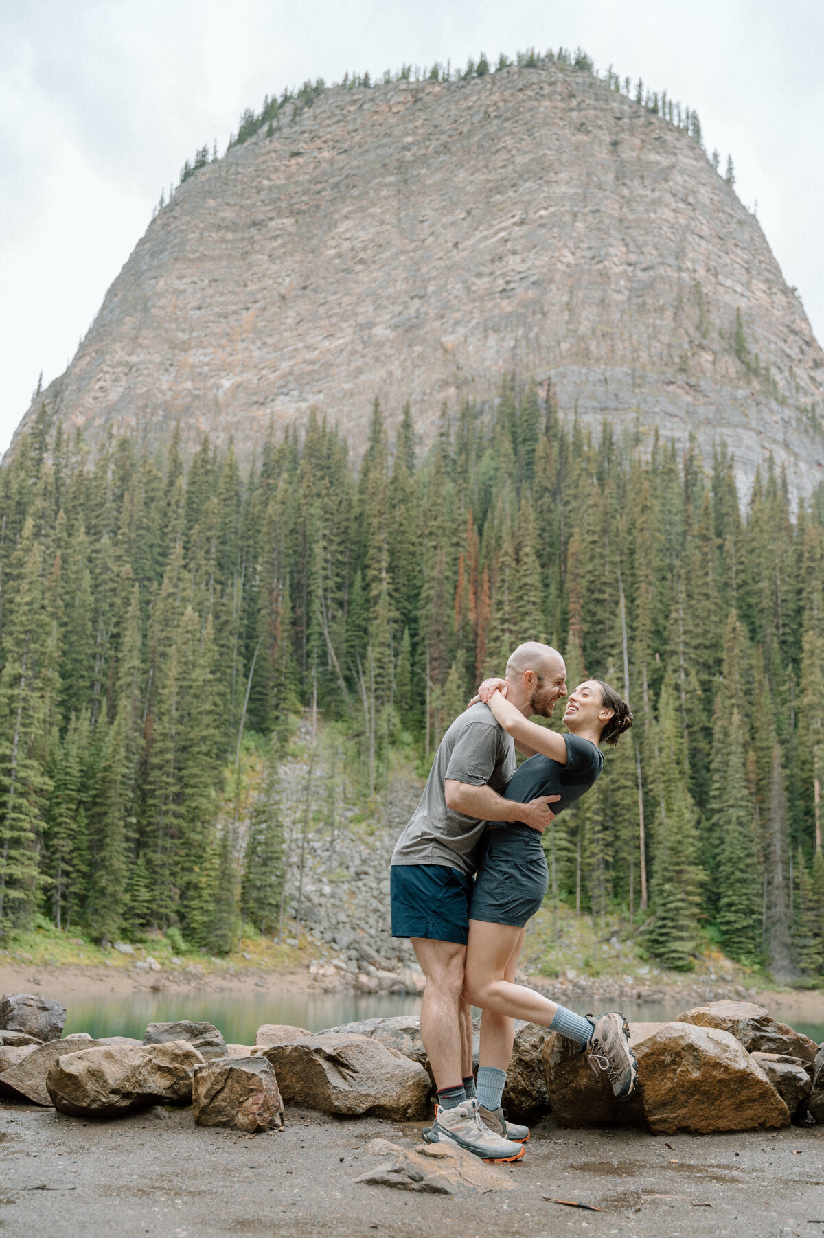 Joyful moments by the lakeside at big beehive, captured during a stunning mountain engagement.