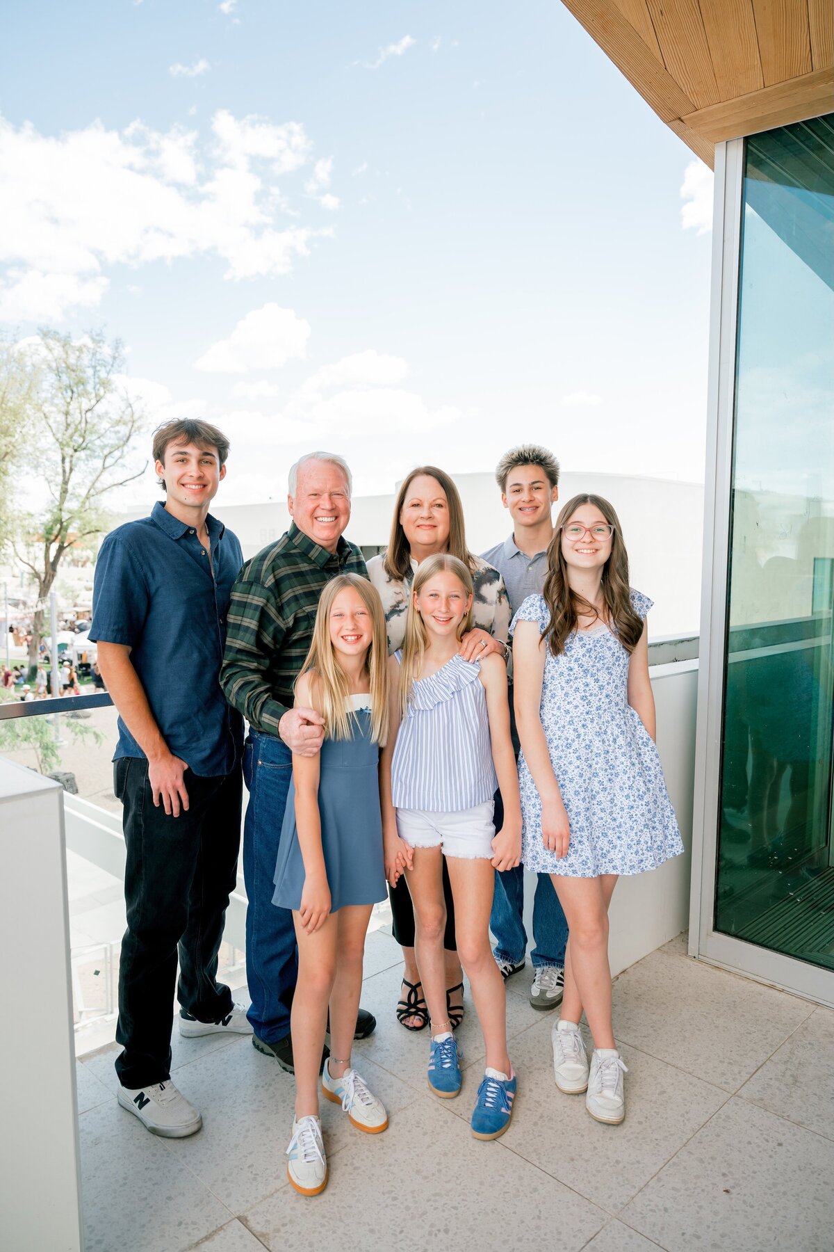family posing for photo in old town scottsdale 
