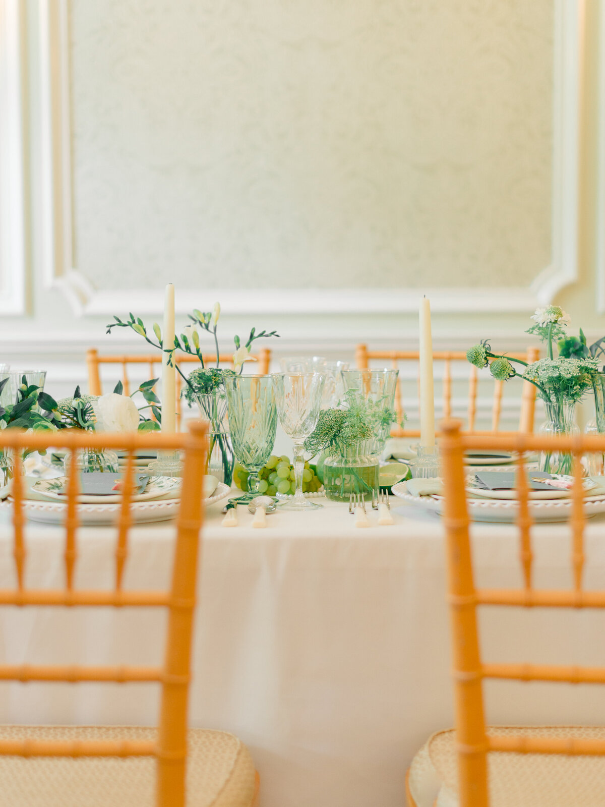 Refined wedding reception table detail at Cairnwood Estate in Bryn Athyn, Pennsylvania. Captured by Philadelphia Fine Art Wedding Photographer Elizabeth Kane, this elegant tablescape features green glassware, delicate white florals, and natural accents styled for a timeless East Coast wedding celebration.