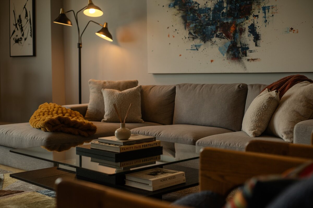 Moody basement living room remodel in Draper, Utah, inspired by mid-century modern design, showcasing a stylish and elegant modern space—designed by  Valt Interiors.