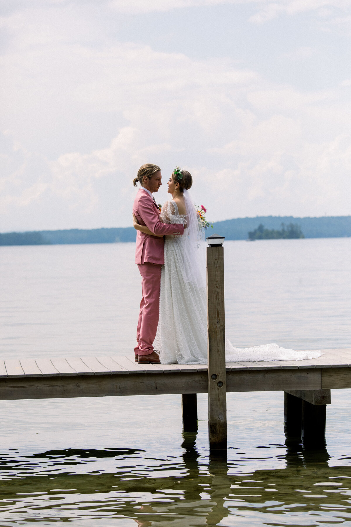 bride and groom at colorful lakeside wedding in New Hampshire