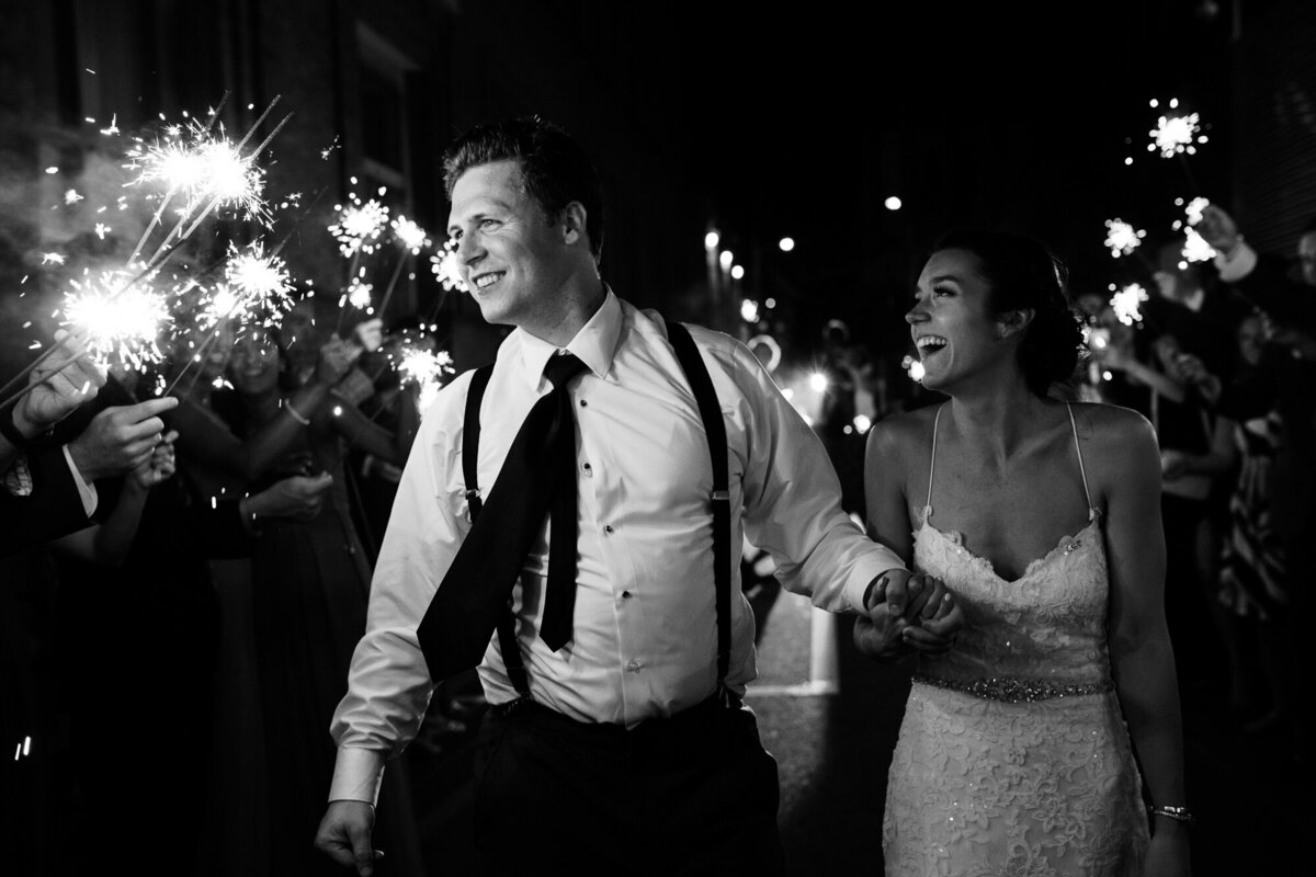 Couple runs through sparkler exit after wedding at the Columbus Athenaeum