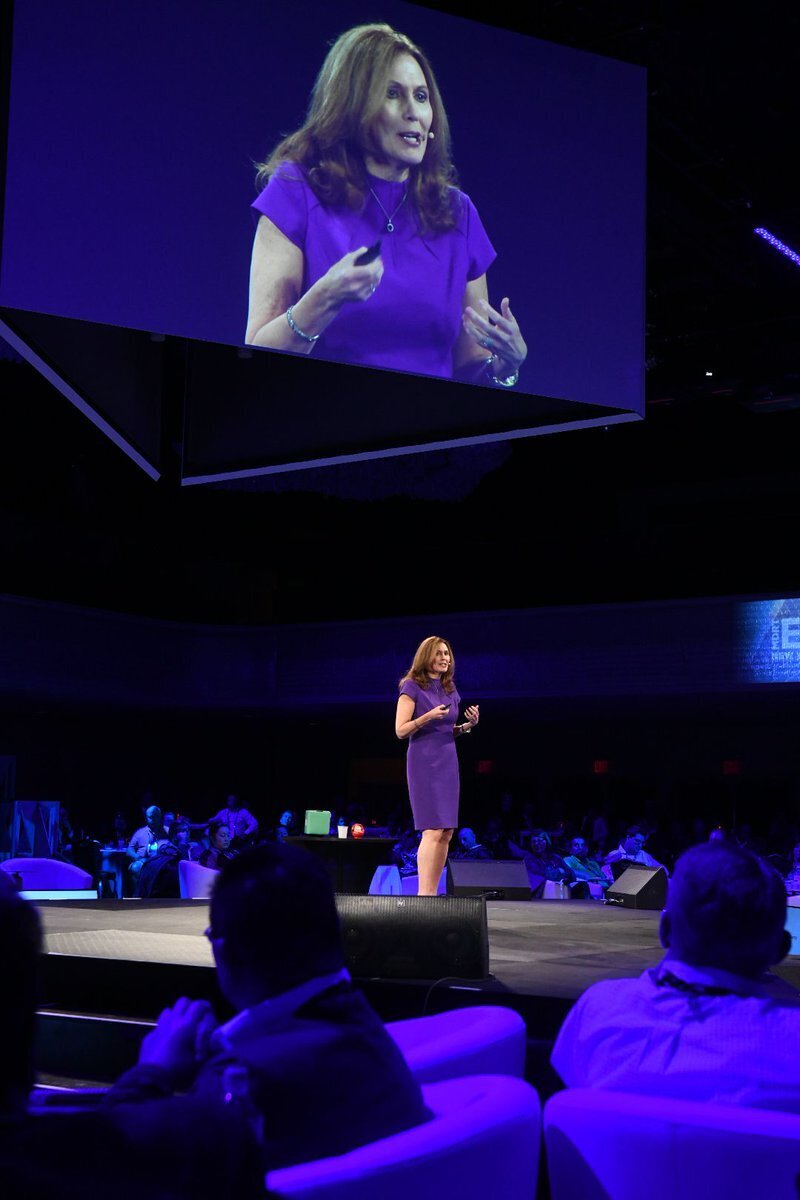 Motivational speaker, Libby Gill, speaking on stage at an event
