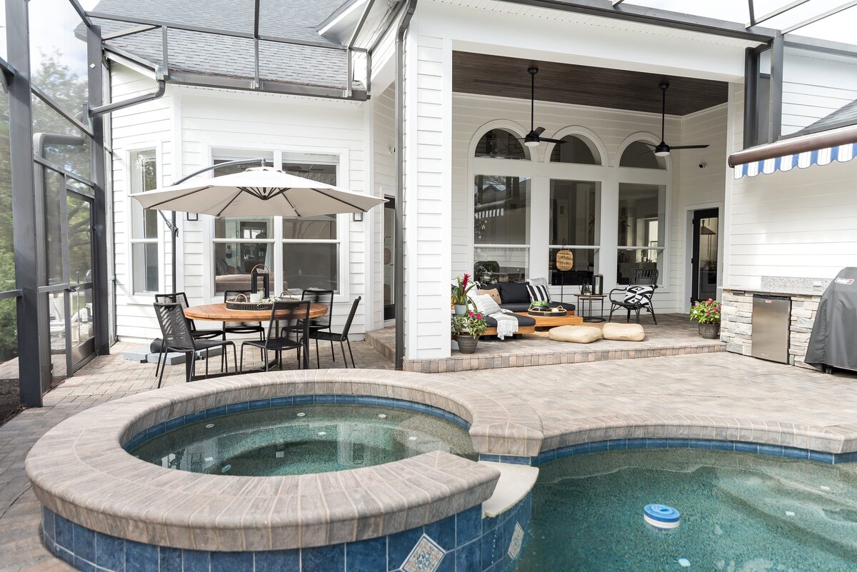 dewine design orlando interior designer modern lakehouse patio area with pool and hot tub