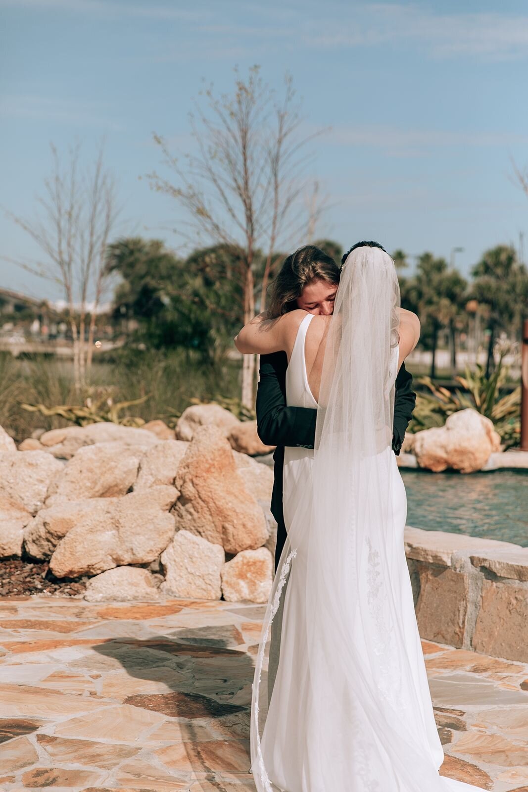 bride and groom hug during their first look