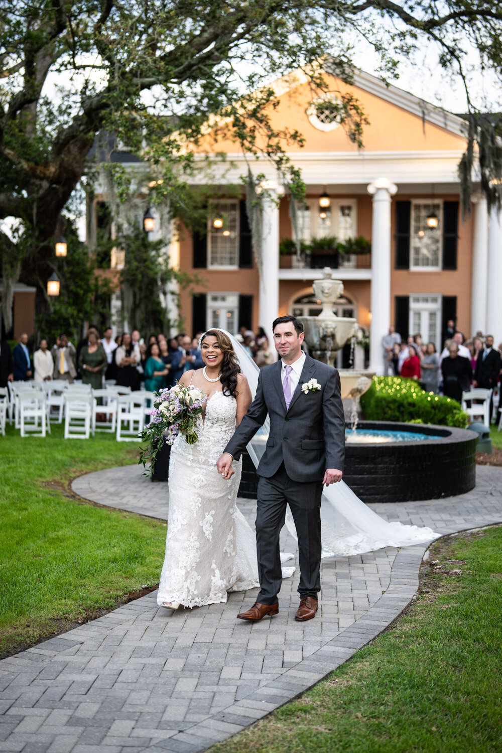 Bride and groom walking down the aisle at Southern Oaks