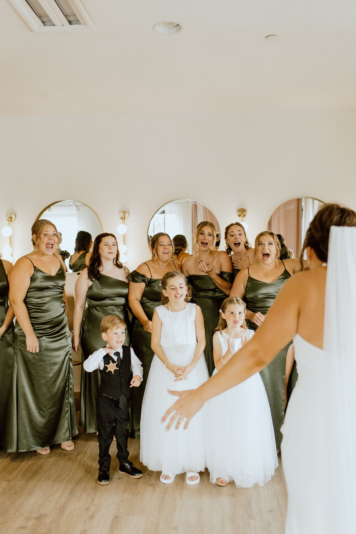 Bridal party getting ready with soft glam makeup and elegant hairstyles in Madison, WI.