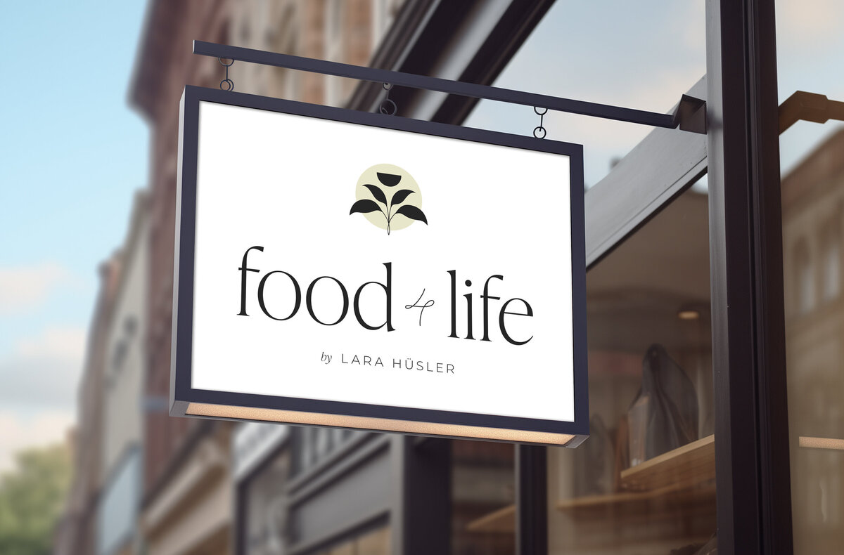 Shop sign with logo of a food photographer