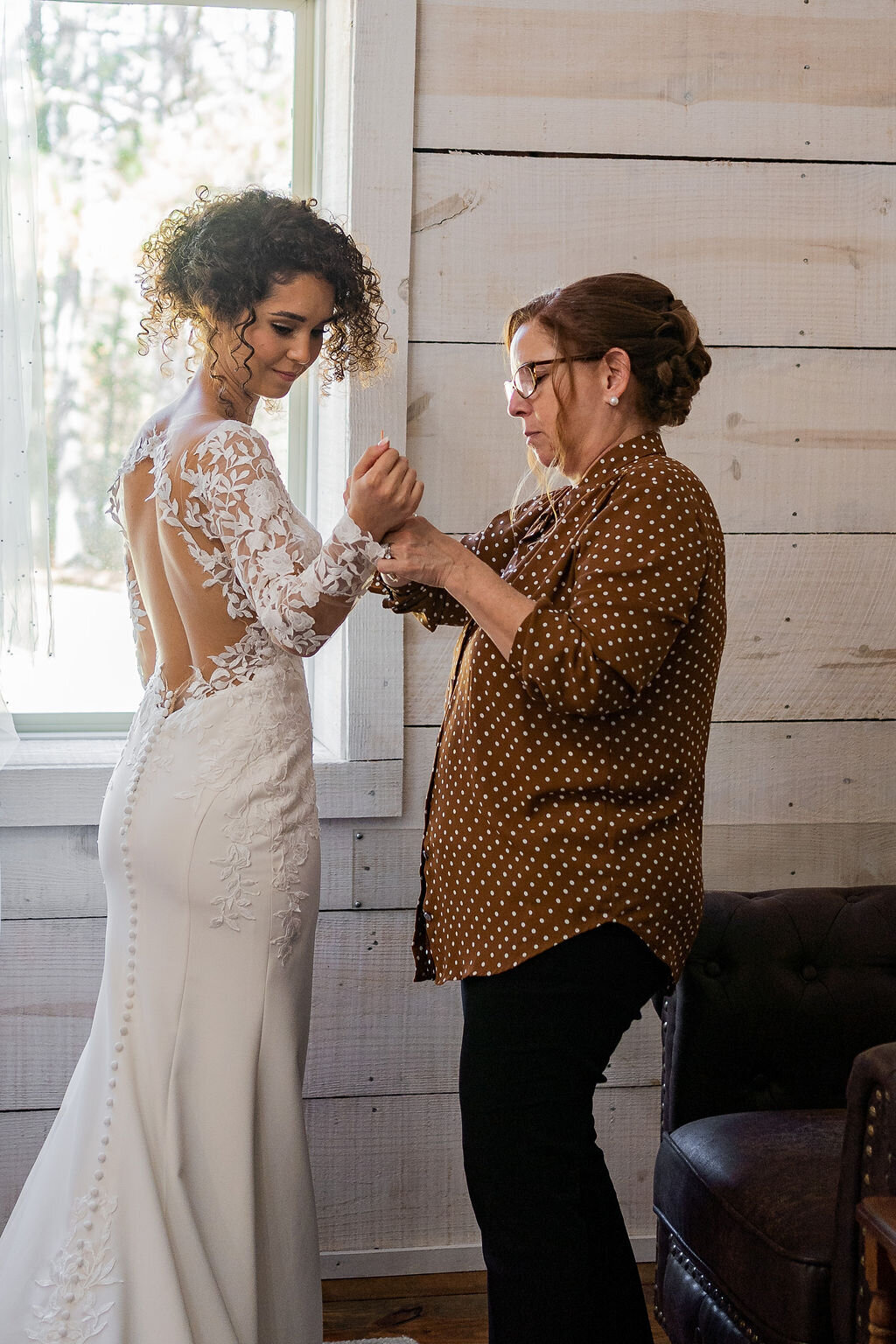 bride getting ready at the bridal villa at Koury Farms