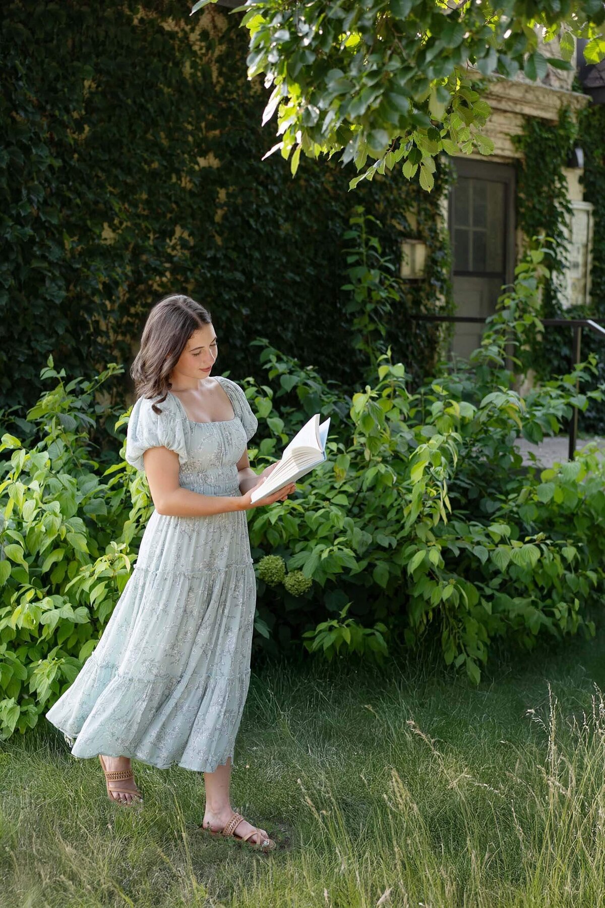 senior-girl-reading-book-in-park