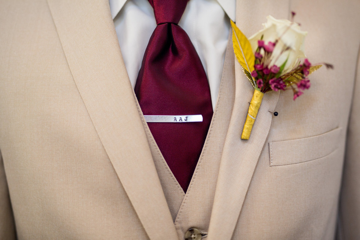 Groomsmen gift from groom custom tie clip and boutonniere floral for tuxedo or suit in san antonio