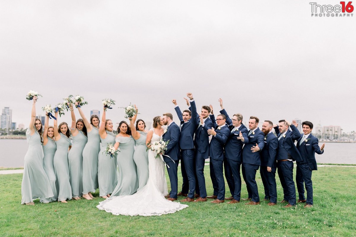 Bridal Party cheers the couple's kiss