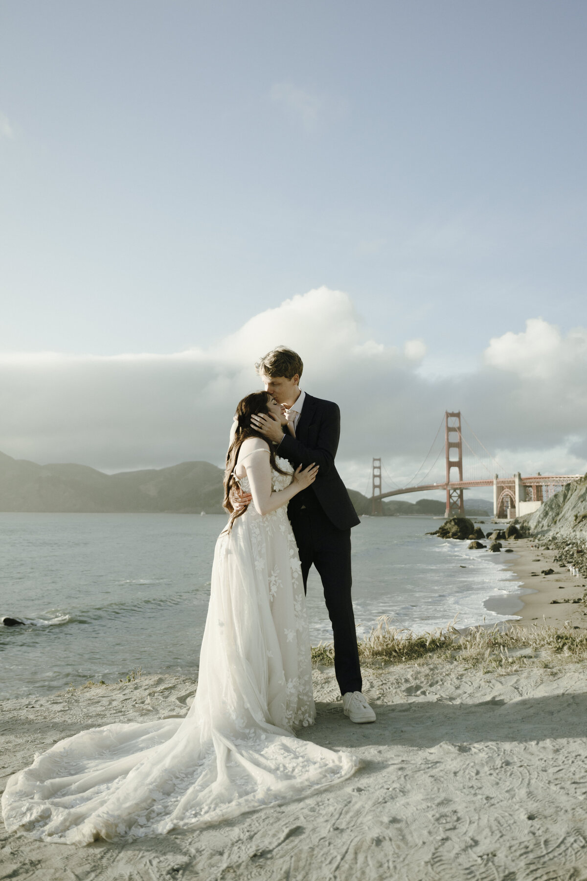 Bride and Groom at Marshall's Beach in San Francisco, California at sunset