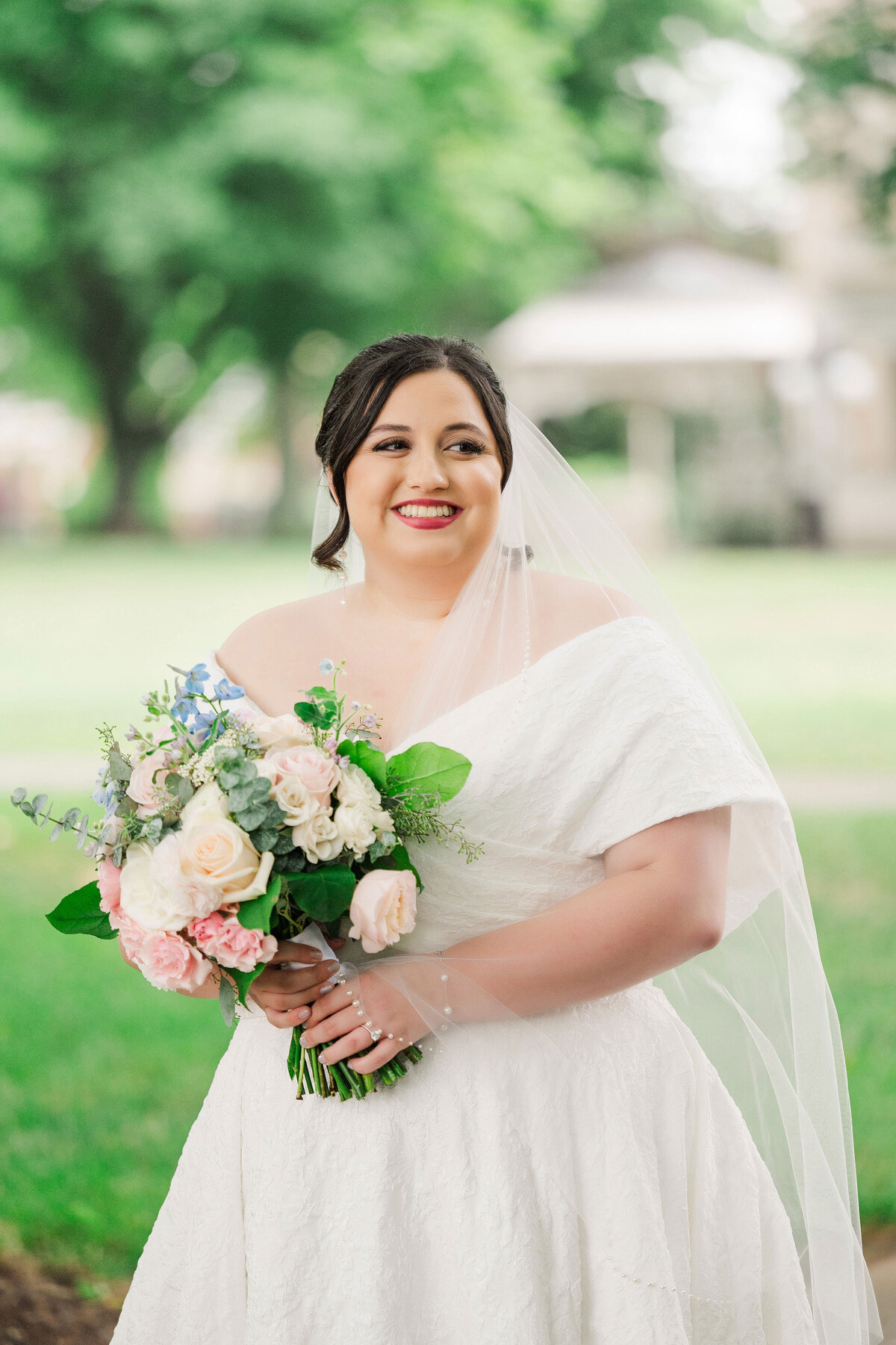bride posing on wedding day at Frick Museum