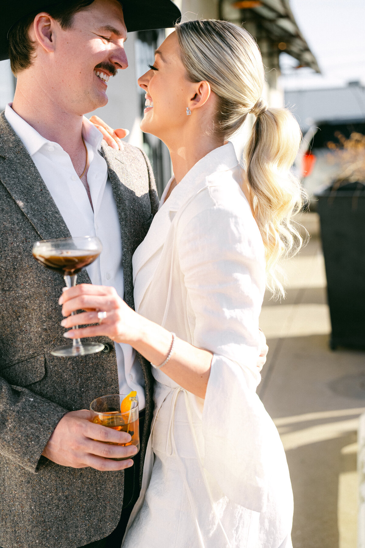 Bride and groom in cowboy hats for their Dallas wedding