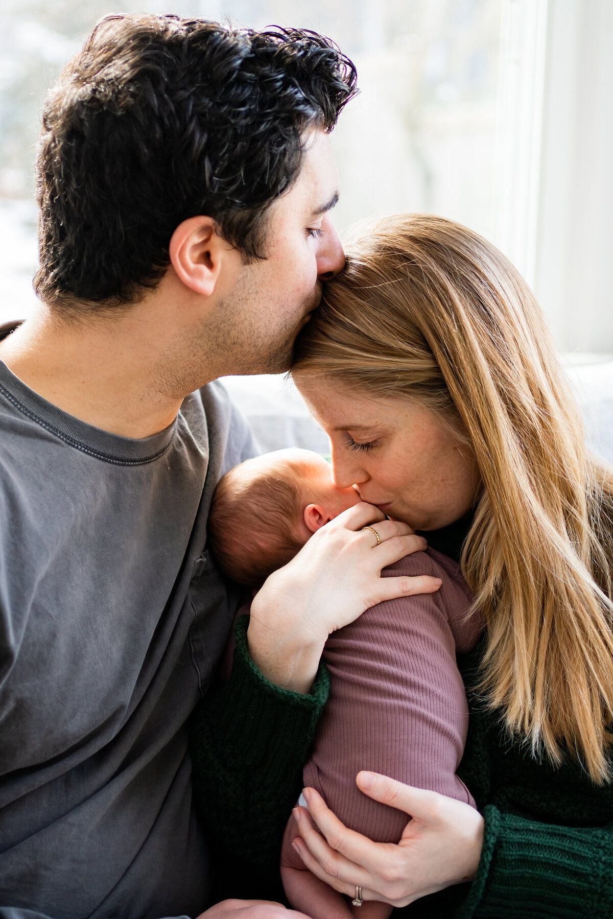 Mom and dad with newborn baby girl in Wayland, MA