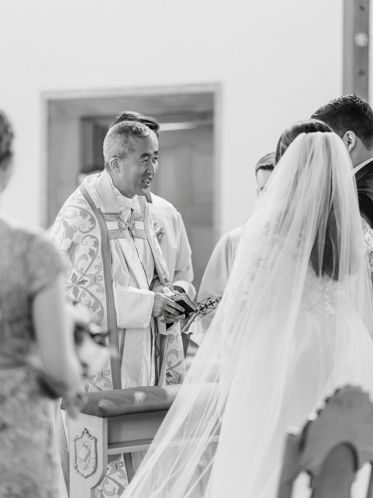 Priest officiating traditional Latin Mass wedding at St Rita Catholic Church in Alexandria, VA 