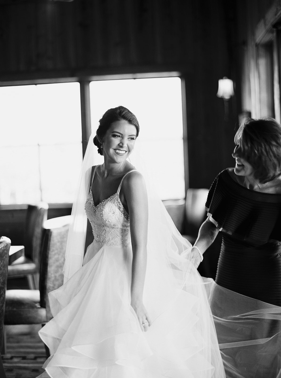 black and white photo of bride smiling